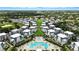 Aerial view of community with pool, golf course, and lush landscaping at 7770 Sandy Ridge Dr # 234, Reunion, FL 34747