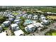 Aerial view of community showing resort-style pool and surrounding homes at 7770 Sandy Ridge Dr # 234, Reunion, FL 34747