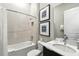 Bright bathroom features a shower-tub combo, vanity, and modern finishes at 7770 Sandy Ridge Dr # 234, Reunion, FL 34747