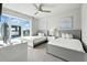 Bright bedroom with two beds, large windows, and modern decor at 7770 Sandy Ridge Dr # 234, Reunion, FL 34747