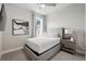 Modern bedroom with a large window for natural light, stylish decor, and an upscale ceiling fan at 7770 Sandy Ridge Dr # 234, Reunion, FL 34747