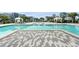 Stunning community pool with inviting cabanas, lounge chairs, and lush landscaping provides a luxurious resort-style atmosphere at 7770 Sandy Ridge Dr # 234, Reunion, FL 34747