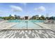 Large community pool features ample lounge seating, umbrellas, and a shallow water play area at 7770 Sandy Ridge Dr # 234, Reunion, FL 34747