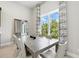 Elegant dining area features a large window and natural light, perfect for meals and entertaining at 7770 Sandy Ridge Dr # 234, Reunion, FL 34747