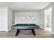 Bright game room with a pool table, artwork, and view to the bathroom at 7770 Sandy Ridge Dr # 234, Reunion, FL 34747