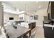 Spacious kitchen with eat-in island overlooks an open-concept living and dining area with tons of natural light at 7770 Sandy Ridge Dr # 234, Reunion, FL 34747