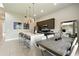Contemporary kitchen with stainless steel appliances, a large island with seating, and an adjacent dining area at 7770 Sandy Ridge Dr # 234, Reunion, FL 34747