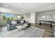 Bright living area featuring a modern sofa, stylish decor, and a pool table, perfect for entertaining guests at 7770 Sandy Ridge Dr # 234, Reunion, FL 34747