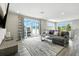 Bright living area featuring a modern sofa, balcony access, and stylish decor, perfect for relaxation and entertaining at 7770 Sandy Ridge Dr # 234, Reunion, FL 34747