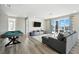 Open-concept living area featuring a pool table, modern sofa, and ample natural light, perfect for entertaining at 7770 Sandy Ridge Dr # 234, Reunion, FL 34747