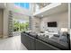 Bright, airy living room with soaring ceilings, large windows, and comfortable seating at 7770 Sandy Ridge Dr # 234, Reunion, FL 34747