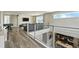 Spacious loft featuring sleek railings, modern furniture, a pool table, and a stylish entertainment center at 7770 Sandy Ridge Dr # 234, Reunion, FL 34747