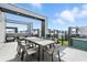 Modern patio with a dining set and views of the city at 7770 Sandy Ridge Dr # 234, Reunion, FL 34747