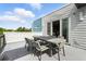 Charming patio with a dining set and a lovely view of the neighborhood at 7770 Sandy Ridge Dr # 234, Reunion, FL 34747