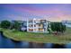 Stunning waterfront home with a modern design, pool, and lush landscaping at 8157 Elion St, Orlando, FL 32827