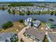 Modern waterfront home with solar panels nestled in a lakeside community at 8157 Elion St, Orlando, FL 32827