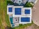 Modern home with solar panels, pool, outdoor lounge, and well-maintained backyard at 8157 Elion St, Orlando, FL 32827