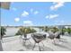 Inviting balcony with comfortable seating, a fire pit, and a view of the water at 8157 Elion St, Orlando, FL 32827