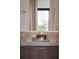 Close-up of the bathroom vanity with elegant decor, stylish fixtures, and wooden cabinets at 8157 Elion St, Orlando, FL 32827