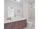 Modern bathroom featuring a sleek vanity, vessel sink, and glass-enclosed shower with tile surround at 8157 Elion St, Orlando, FL 32827