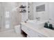 Bright bathroom with walk-in shower, floating shelves, and vessel sink at 8157 Elion St, Orlando, FL 32827