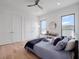 Comfortable bedroom featuring hardwood floors, closet space, and windows with neighborhood views at 8157 Elion St, Orlando, FL 32827