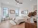 Cozy bedroom featuring a comfortable bed, hardwood floors, and natural light at 8157 Elion St, Orlando, FL 32827