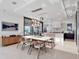 Open concept dining area flowing into a modern kitchen with patio access at 8157 Elion St, Orlando, FL 32827