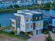 Three-story modern home with solar panels, a pool, and a two-car garage at 8157 Elion St, Orlando, FL 32827