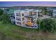 Stunning three-story modern home boasting a private pool and multiple balconies at 8157 Elion St, Orlando, FL 32827