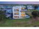 Modern home with a backyard pool, balconies, and stylish outdoor furniture at 8157 Elion St, Orlando, FL 32827