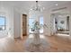 Bright and airy foyer with marble table, stylish light fixture, and elevator access at 8157 Elion St, Orlando, FL 32827