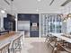Stunning contemporary kitchen featuring custom cabinetry, stainless steel appliances, and a glass-enclosed wine room at 8157 Elion St, Orlando, FL 32827