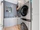 Well-organized laundry room with modern washer and dryer units and ample storage space at 8157 Elion St, Orlando, FL 32827