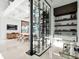 Bright and airy living room with a glass wine cellar and open floor plan at 8157 Elion St, Orlando, FL 32827