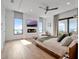 Inviting main bedroom with a fireplace, TV, and views from multiple windows at 8157 Elion St, Orlando, FL 32827