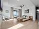 Spacious main bedroom with a ceiling fan, balcony access, and neutral decor at 8157 Elion St, Orlando, FL 32827
