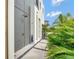 Contemporary outdoor shower with modern fixtures and lush tropical landscaping at 8157 Elion St, Orlando, FL 32827