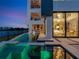 Contemporary home showcasing a stylish pool area with integrated spa and outdoor entertaining space at 8157 Elion St, Orlando, FL 32827