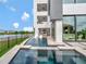 Elegant home with a stunning pool featuring a spa, water features, and seamless indoor-outdoor living at 8157 Elion St, Orlando, FL 32827