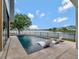A stunning pool with lounge chairs and views of a serene lake at 8157 Elion St, Orlando, FL 32827