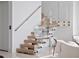 Modern staircase with glass railings and wooden steps leading to the upper level at 8157 Elion St, Orlando, FL 32827