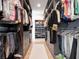 Organized walk-in closet featuring custom shelving and ample storage space at 8157 Elion St, Orlando, FL 32827