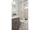 Stylish bathroom features decorative tilework, a shower-tub combo, and a modern vanity at 940 Club Cresswind Dr, Lady Lake, FL 32159