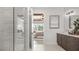 Elegant bathroom featuring a glass-enclosed shower and view of the bedroom at 940 Club Cresswind Dr, Lady Lake, FL 32159