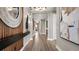 Grand entryway features a decorative mirror, modern lighting and opens to living space at 940 Club Cresswind Dr, Lady Lake, FL 32159
