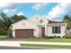 Inviting single-Gathering home with a two-car garage and a well-manicured lawn at 940 Club Cresswind Dr, Lady Lake, FL 32159