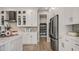 Contemporary kitchen featuring stainless steel appliances, a walk-in pantry, and modern backsplash at 940 Club Cresswind Dr, Lady Lake, FL 32159