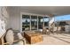 Inviting outdoor lanai area with comfortable seating, dining area, and summer kitchen at 940 Club Cresswind Dr, Lady Lake, FL 32159