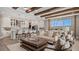 Gourmet kitchen flows into the living room with beamed ceiling and eat in bar at 940 Club Cresswind Dr, Lady Lake, FL 32159